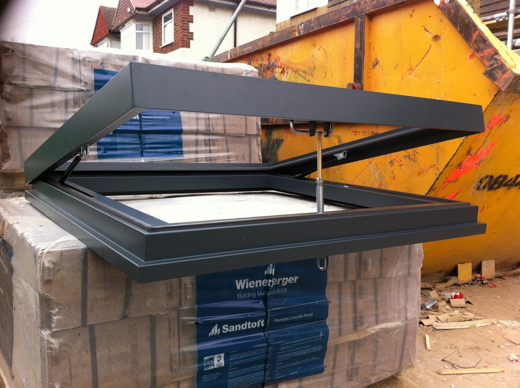 Opening flat roof skylight in anthracite grey installed in Merton